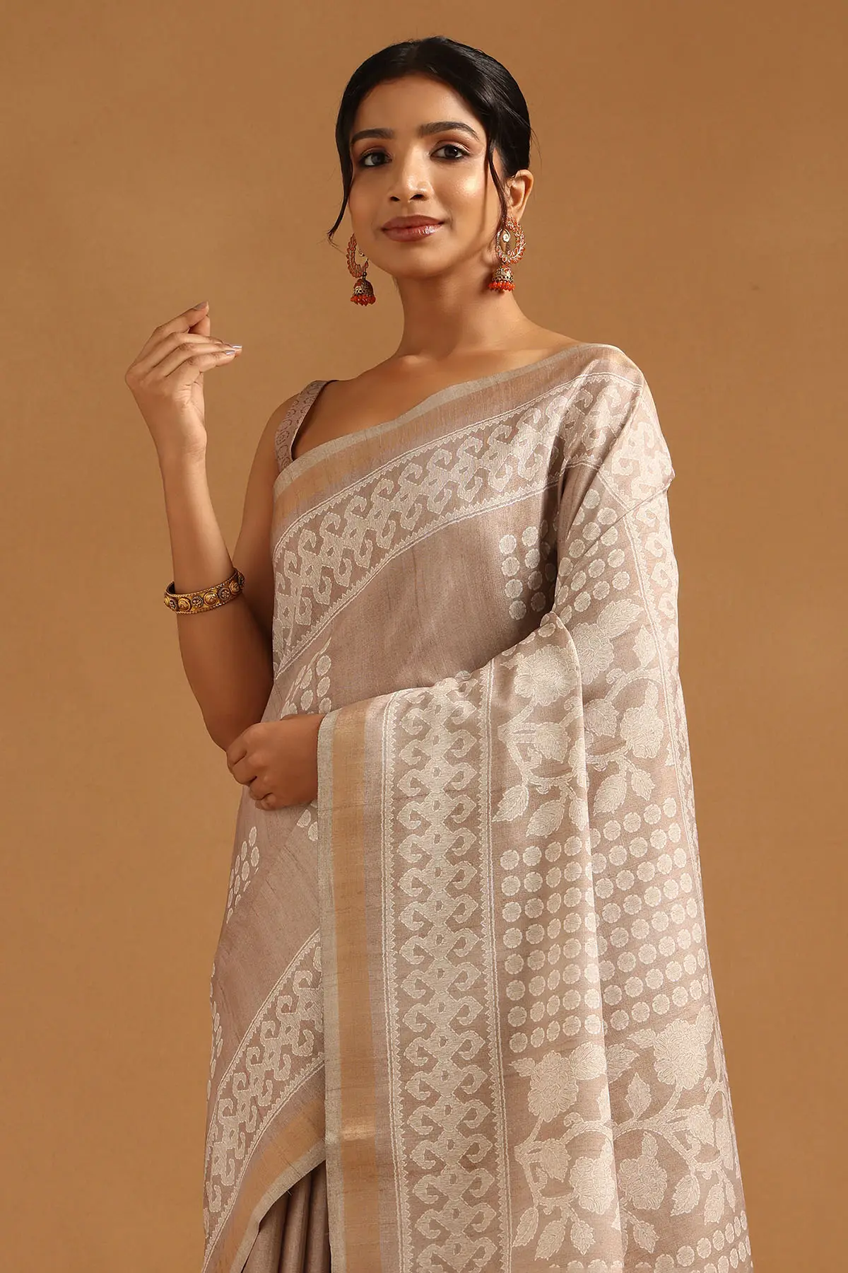Beige Art Silk Ethnic Motifs Saree With Tassels